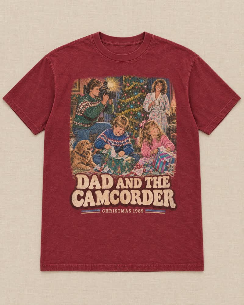 The Dad and the Camcorder shirt in Cranberry: Dad got the camcorder and filmed every single present, light blazing. Somewhere there are three hours of you squinting.