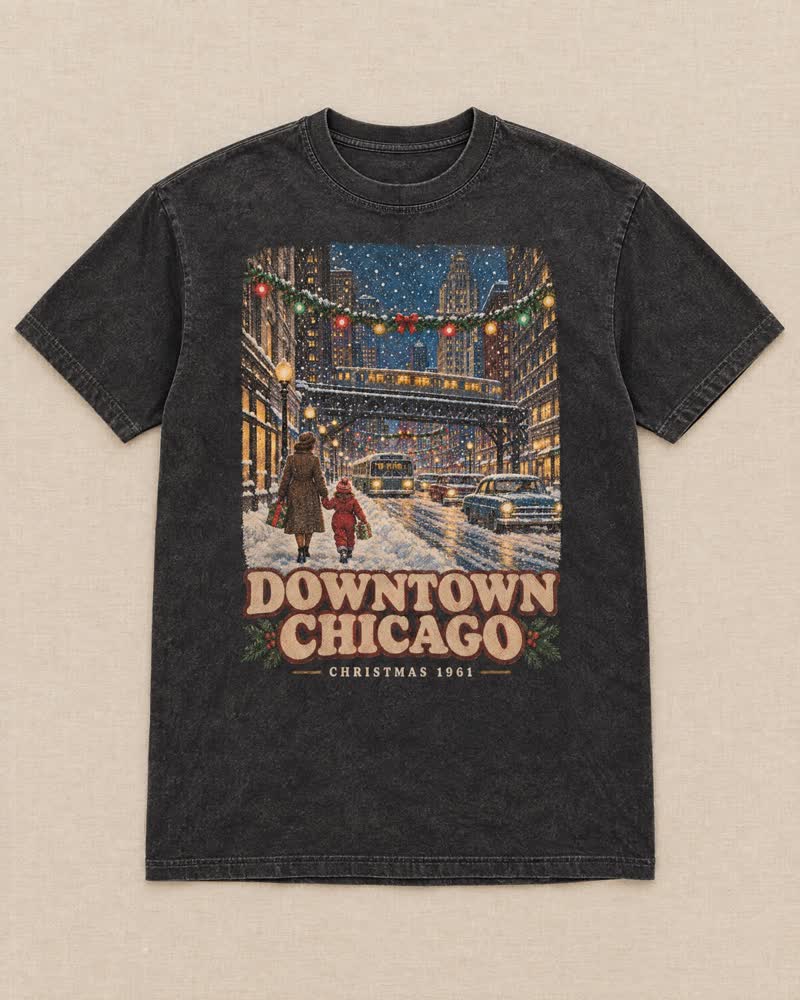 The Downtown Chicago shirt in Midnight: The train ride into the city, the snow coming down between the tall buildings, the L rumbling overhead and the lights strung across the street. Downtown at Christmas.