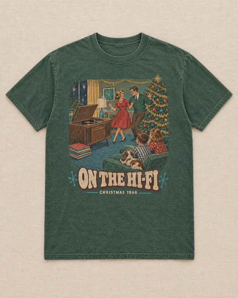 The On the Hi-Fi shirt in Moss: Dad lifted the lid, put the Christmas records on the hi-fi and the stack played all evening. Then he danced with Mom by the tree.