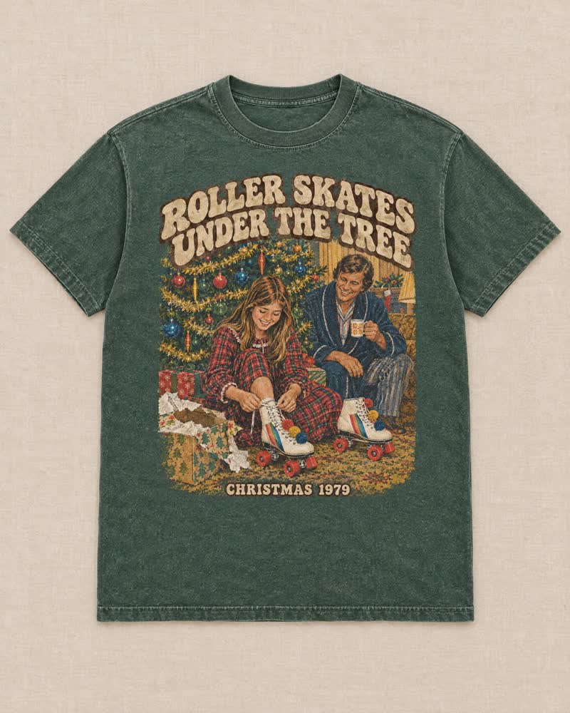 The Roller Skates Under the Tree shirt in Moss: White skates with the rainbow stripes and pom-poms. You skated in the kitchen before breakfast and Dad let you.