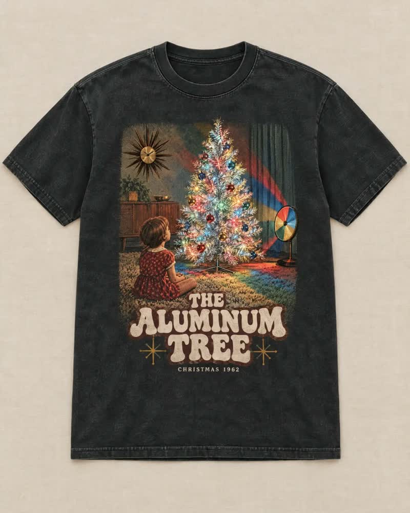 The The Aluminum Tree shirt in Midnight: The silver tree that never shed a needle, and the color wheel that turned it red, then blue, then green, then gold. You sat on the rug and watched it go around.